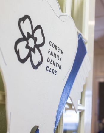 Tooth-shaped sign that reads Corbin Family Dental Care